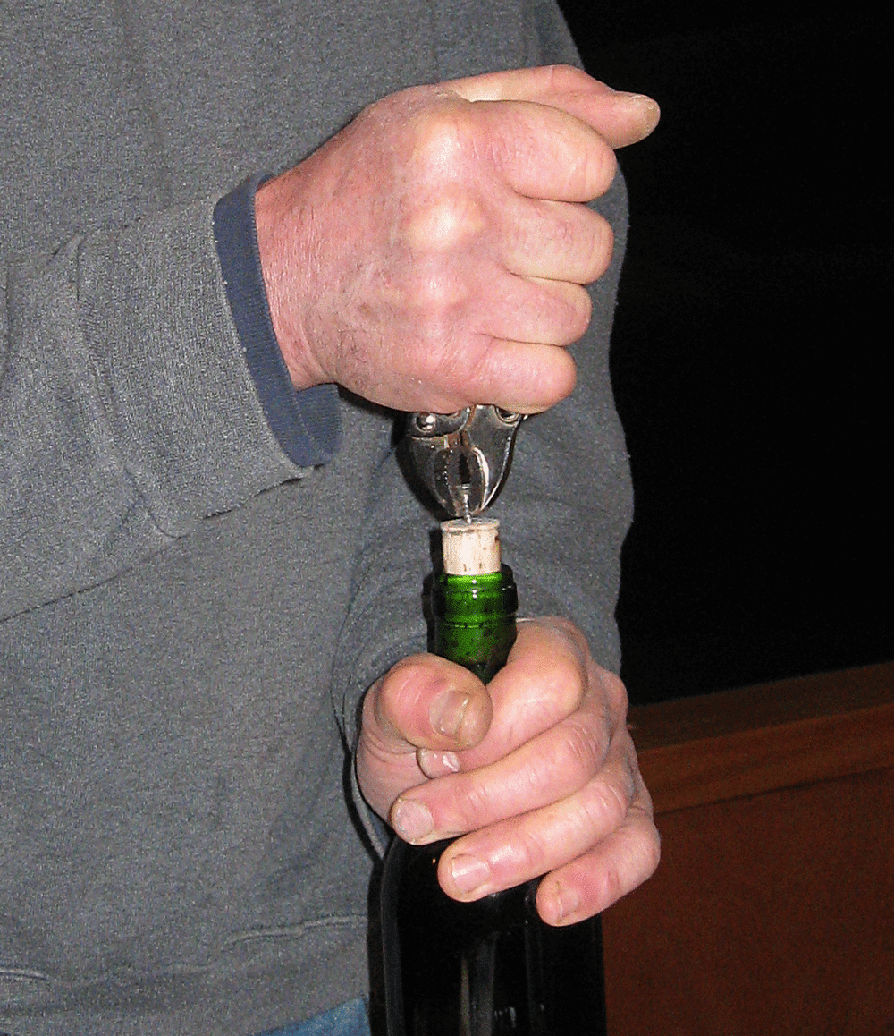 Removing wine cork screw locking pliers