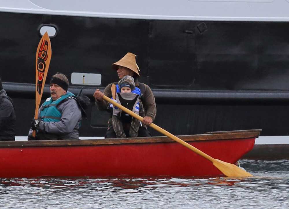  One People Canoe Society founder Doug Chilton including his child in this cultural event. 