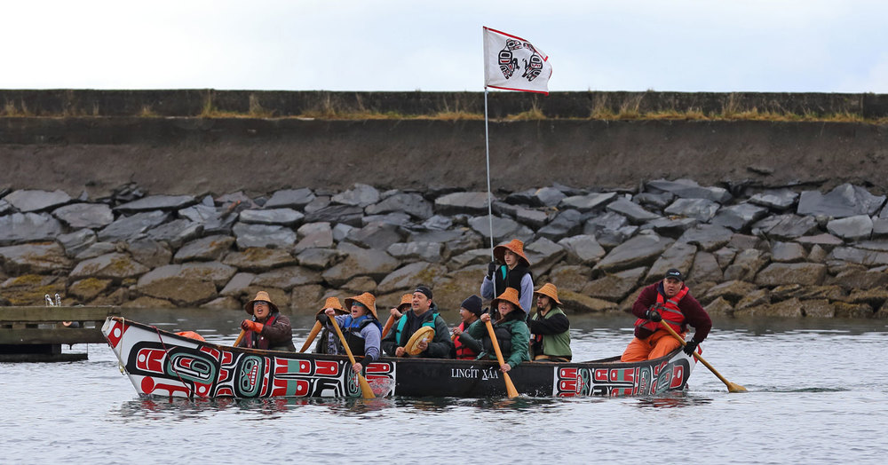 Singing and drumming while paddling into the harbor.