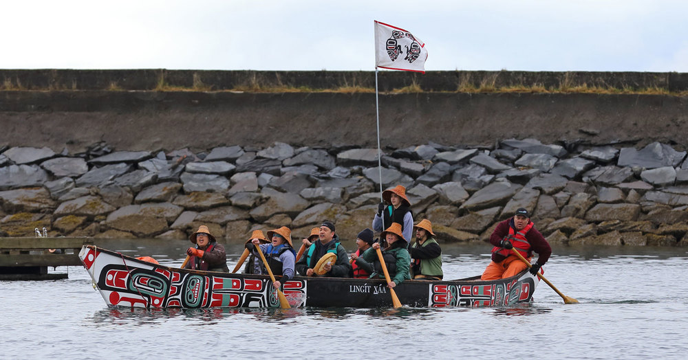  Singing and drumming while paddling into the harbor.  