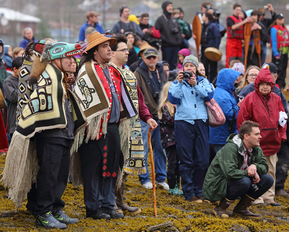  Greeting the canoes and calling them to shore. 