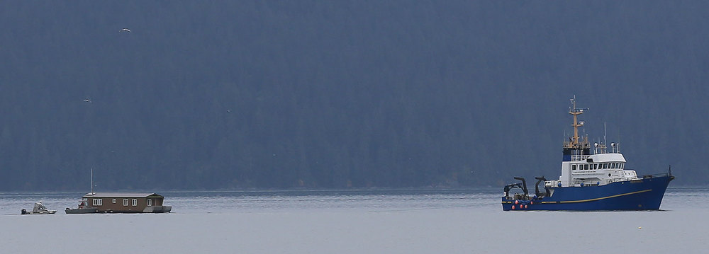 Alaska Fish and Game research vessel "Kestrel" towing a floathouse.