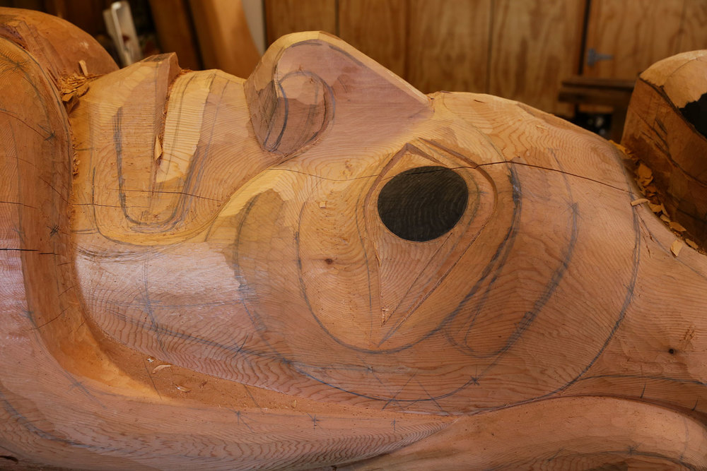 A totem pole taking form in the carving shed at Saxman Alaska