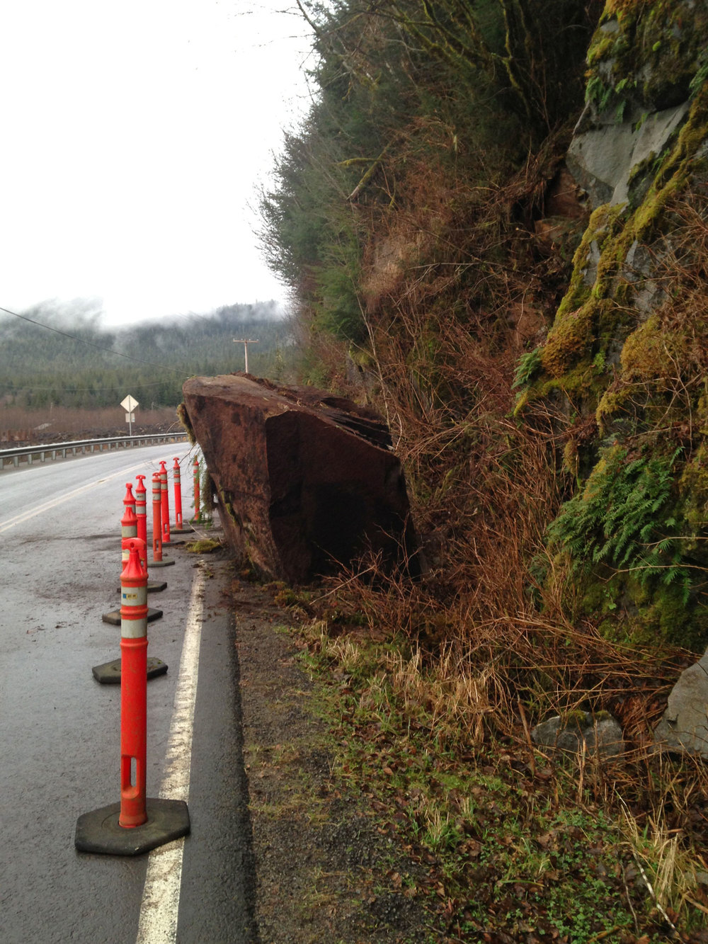 Huge rock on road fell from cliff giant stone huge rock