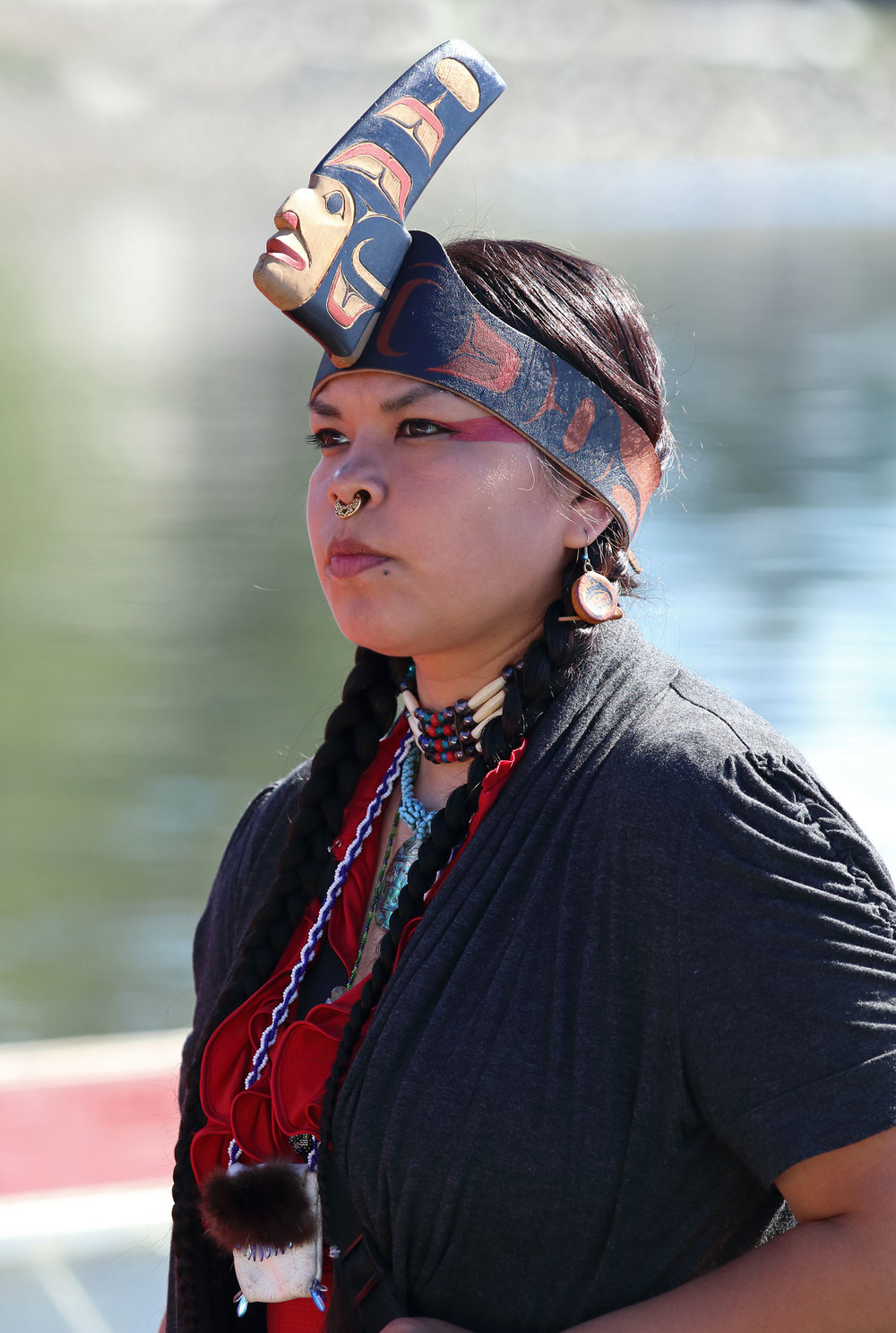 This beautiful Haida woman stood by the canoe that she helped paddle to the ceremony in Kasaan.