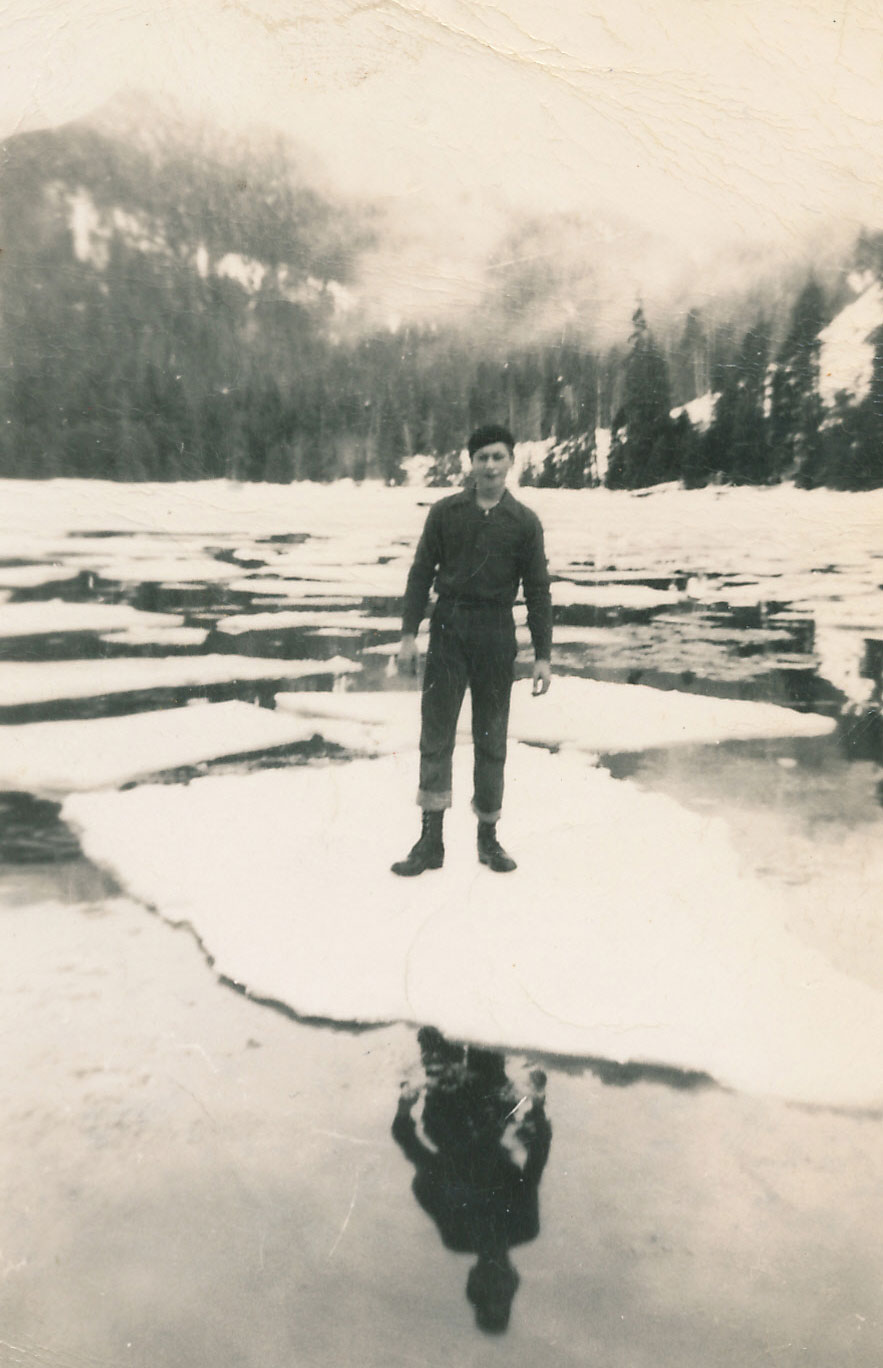 Chuck standing on an ice cake Hood Bay Admiralty Island winter 1950