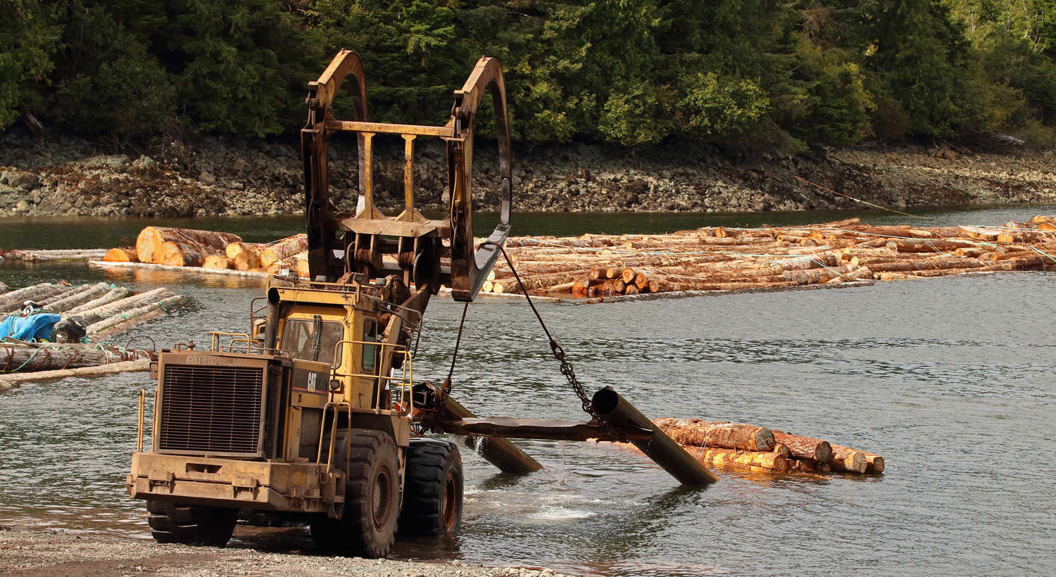 Caterpillar 988F pulling the log skid up the beach on Prince of Wales Island in Southeast Alaska