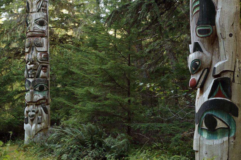 Totem poles at the Kasaan Totem Park next to the Whale House.