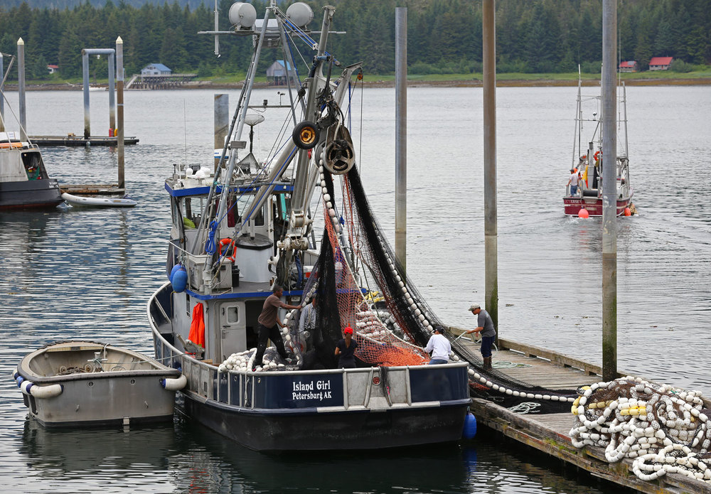 Five crew members stacking the net on the F/V ISLAND GIRL in Petersburg, Alaska.