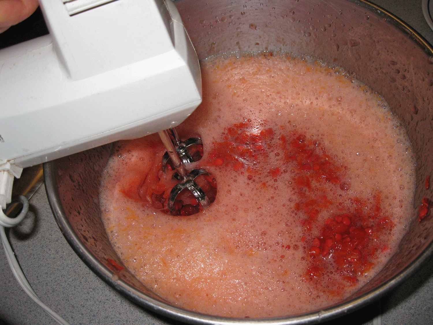 Mixing water with the seed mash.