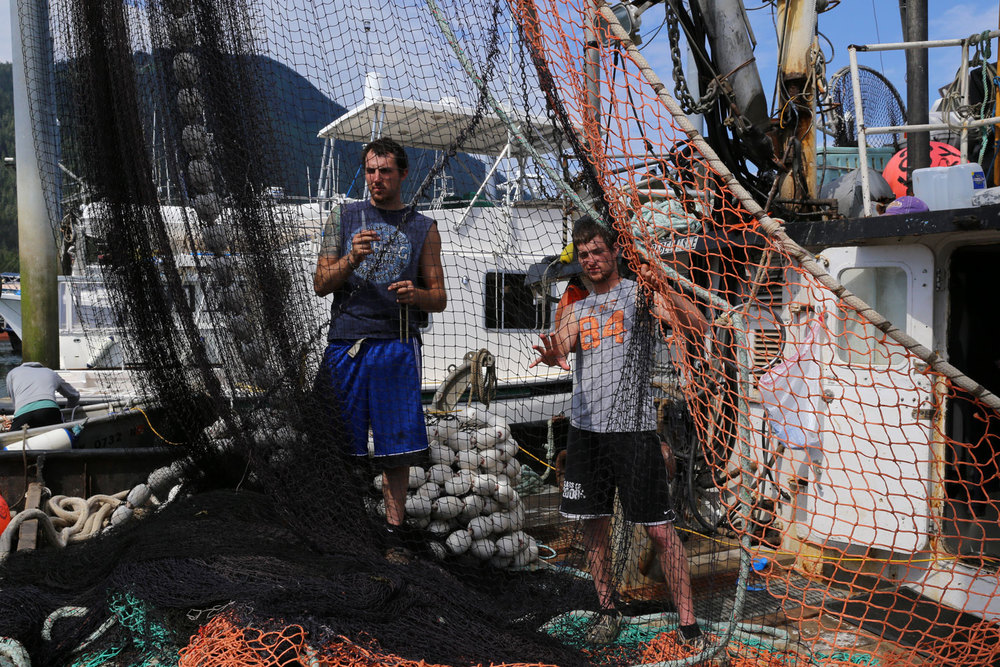 Men working seine net on REBEL ISLE Petersburg Alaska southeast  commercialfishing boat fishermen