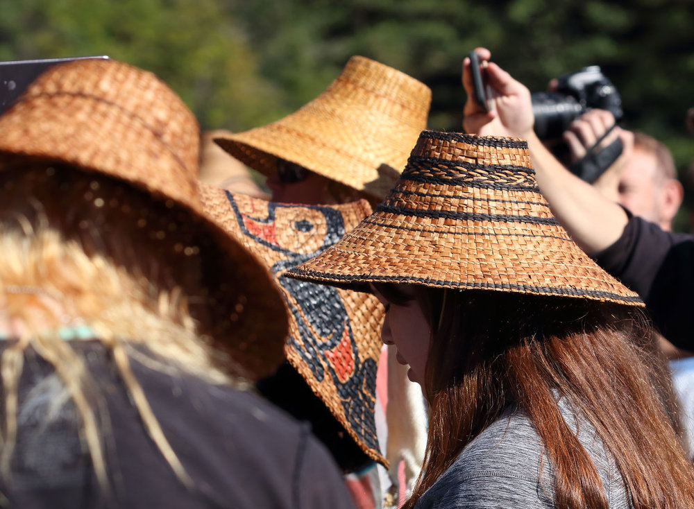 Cedar bark hats (and cell phones taking photos) were everywhere!