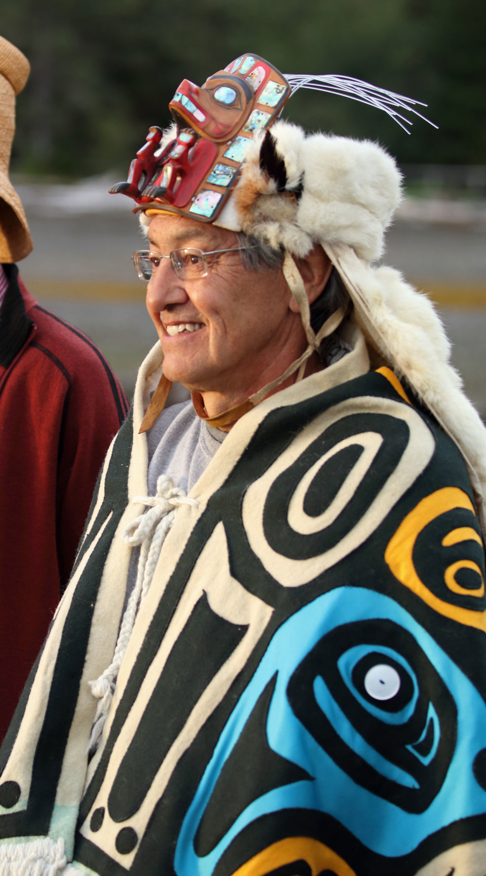 Chief Son-I-Hat John McAllister greeting arriving visitors.