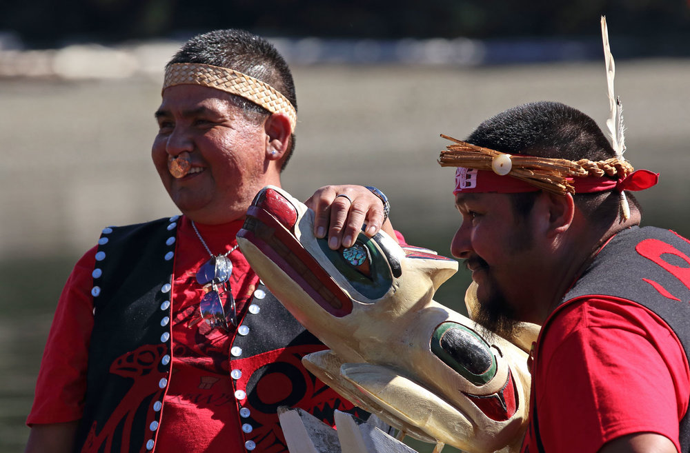 Men stand at the prow of their canoe at the Whale House Rededication ceremony. Humor is an important part of Haida culture, and there was a lot of laughter at the celebration.