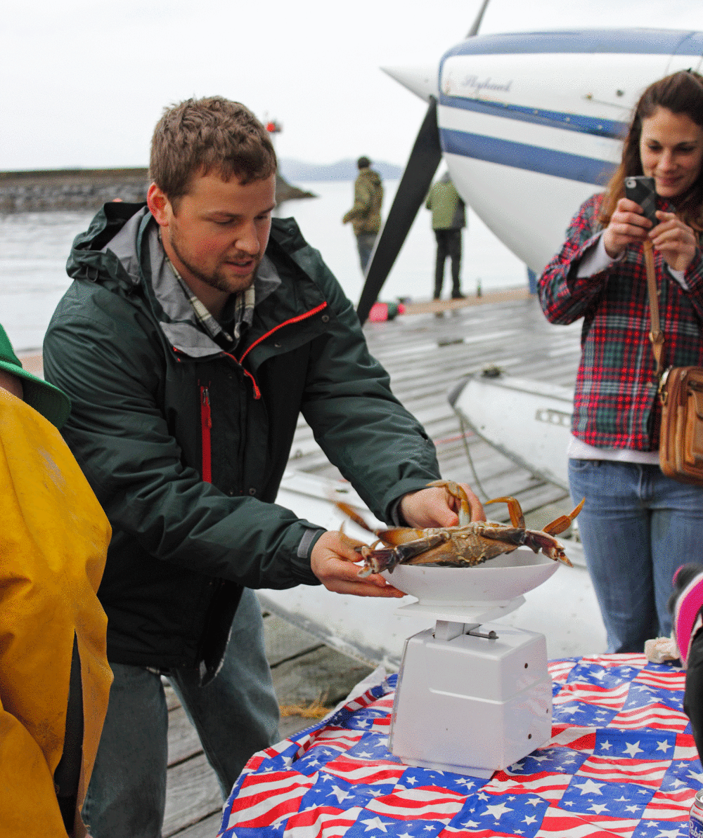  Weighing in a crab at the Adult Scrapfish Derby. 